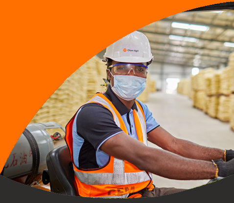 Olam Agri employee on a forklift