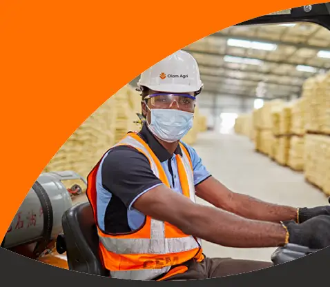 Olam Agri employee on a forklift