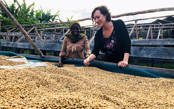 Julie Greene, Chief Sustainability Officer, Olam Group and Olam Agri with a coffee farmer at the Democratic Republic of Congo in 2018